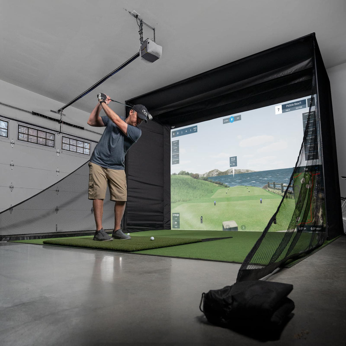 Carl's Place: DIY Golf Simulator Enclosure Kit with Impact Screen - Man hitting on golf simulator