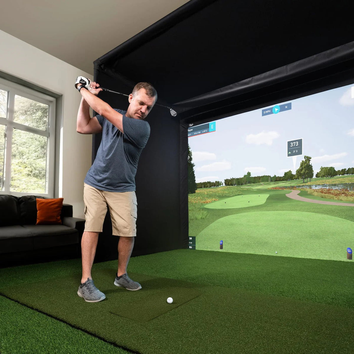 Carl's Place: Pro Golf Simulator Enclosure Kit with Impact Screen - man hitting on golf simulator