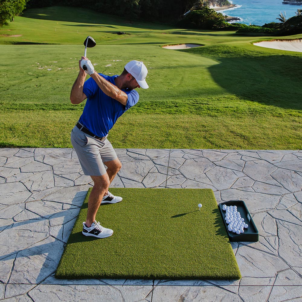 Man Hitting on Golf Mat