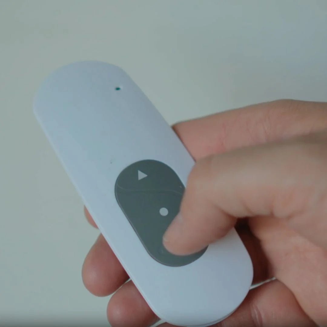 Home golfer holding a G-trak remote