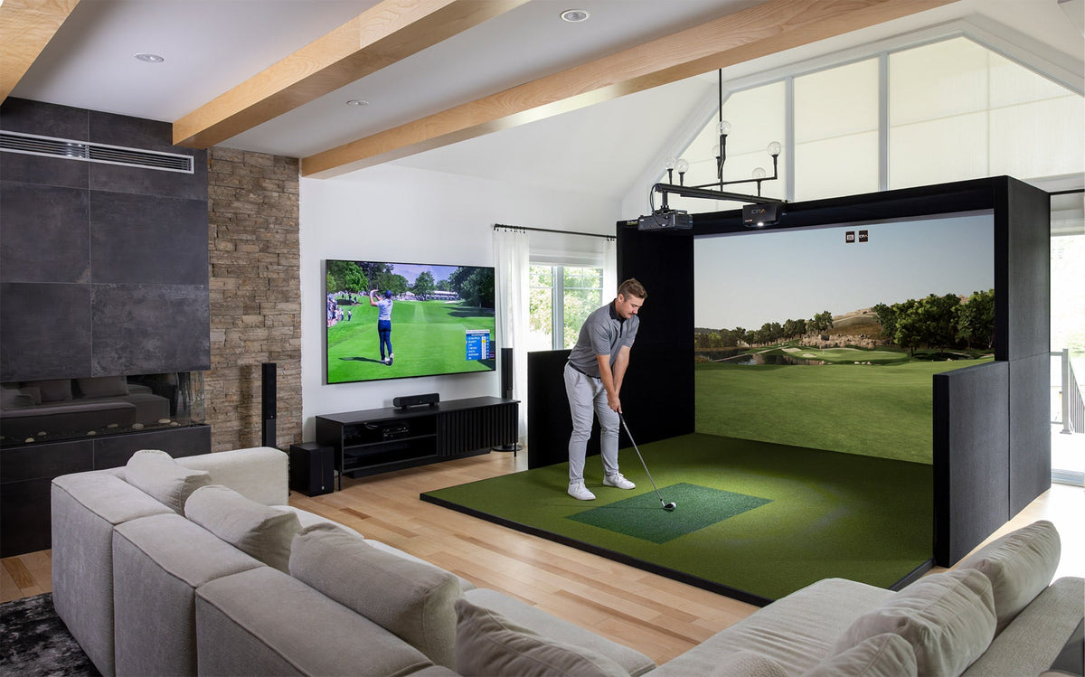 Alternate view of home golfer inside a living room, using the Simbooth 2 kit setup.